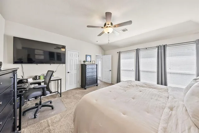 a view of a livingroom with workspace and a window