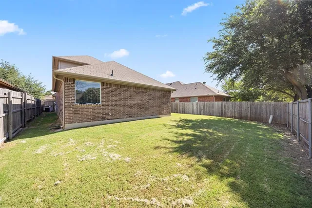 a swimming pool with some trees in the background