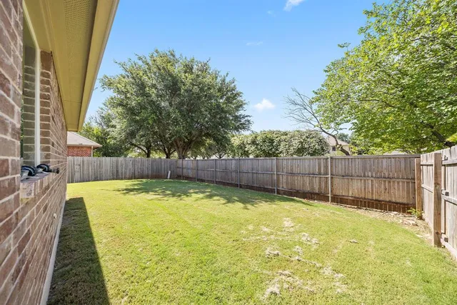 a swimming pool with wooden fence