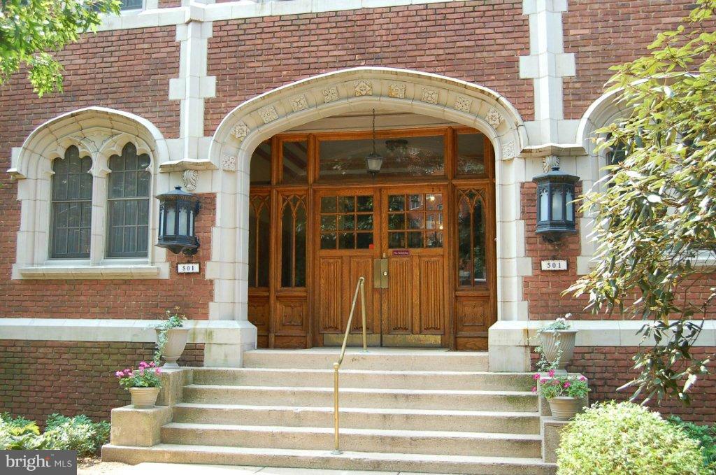 501 West University Parkway, Unit C1 Baltimore, MD 21210 - Photo 1 of 29 a view of entrance of building with a garden
