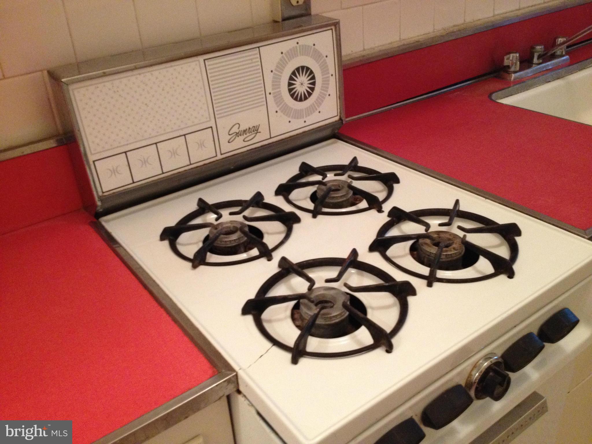 501 West University Parkway, Unit C1 Baltimore, MD 21210 - Photo 12 of 29 a close up of a stove top oven sitting inside of a kitchen
