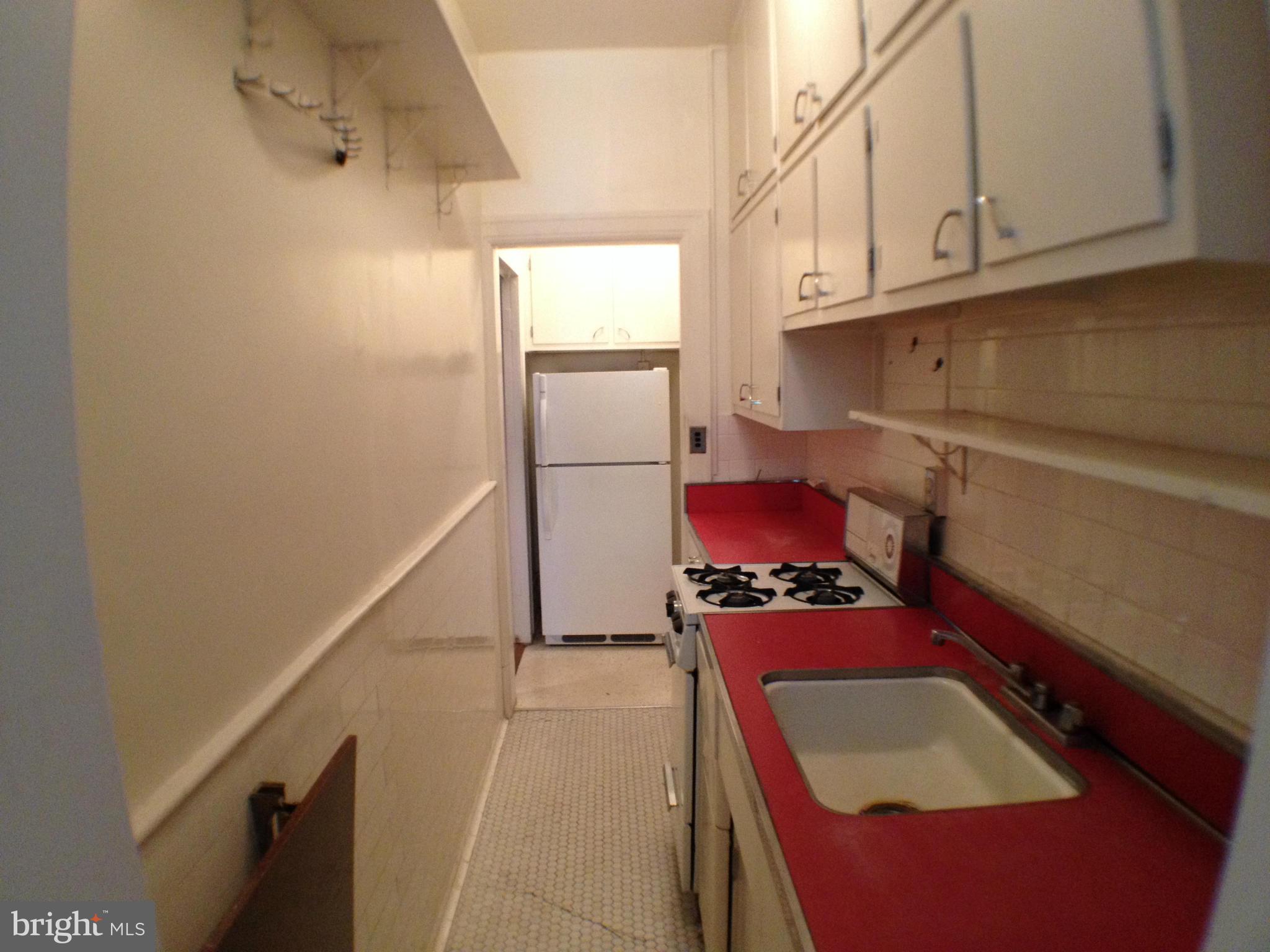 501 West University Parkway, Unit C1 Baltimore, MD 21210 - Photo 13 of 29 a hallway with washer and dryer