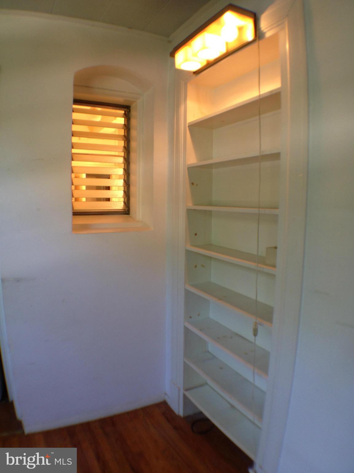 501 West University Parkway, Unit C1 Baltimore, MD 21210 - Photo 20 of 29 a view of walk in closet with empty racks