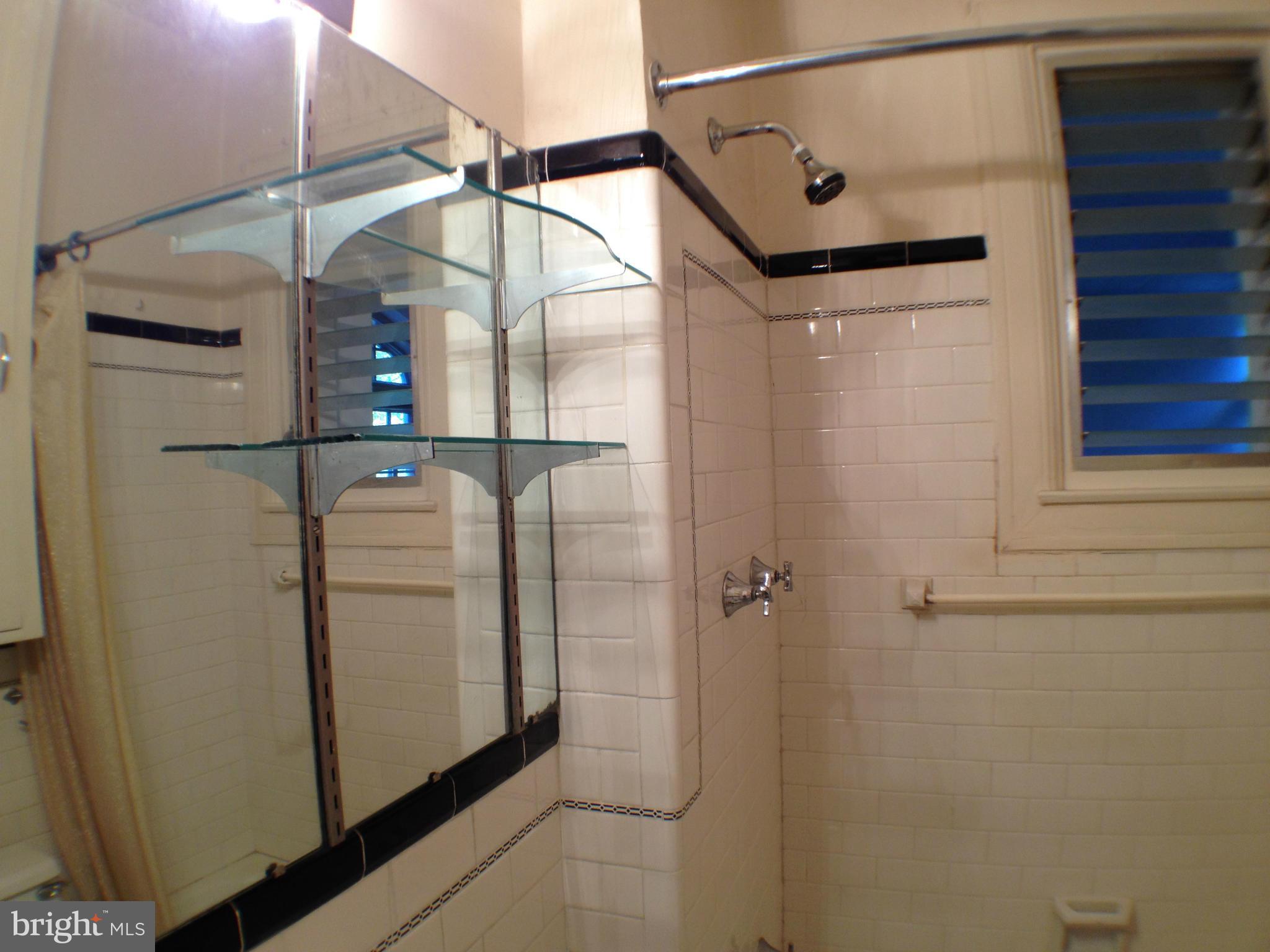 501 West University Parkway, Unit C1 Baltimore, MD 21210 - Photo 22 of 29 a bathroom with a shower