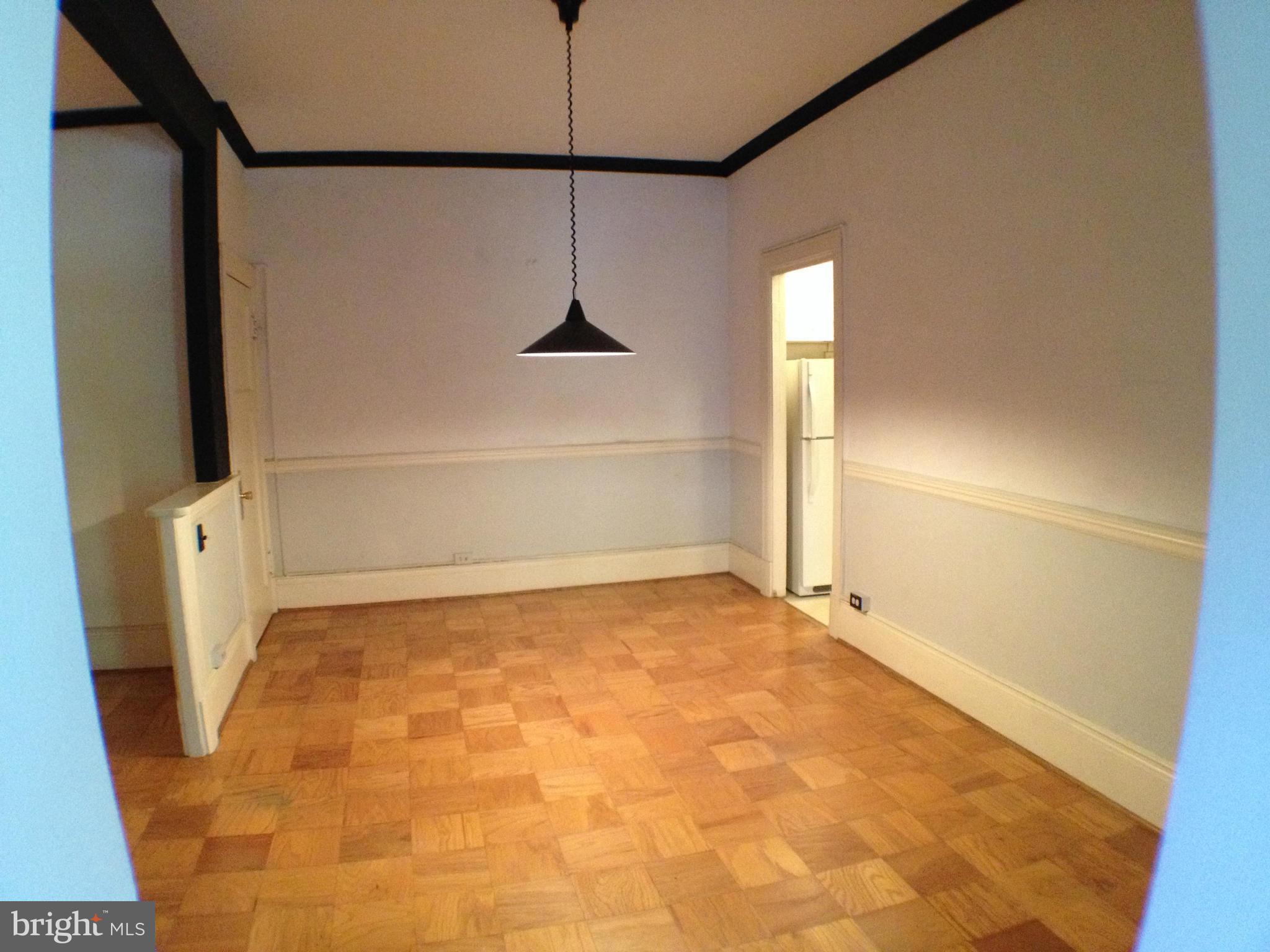 501 West University Parkway, Unit C1 Baltimore, MD 21210 - Photo 9 of 29 a view of an empty room with a fireplace