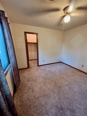 a view of empty room with a fireplace