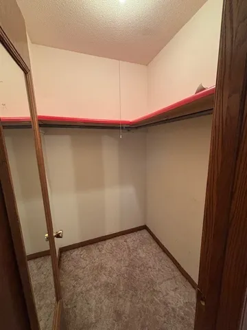 a view of a storage & utility room with a sink