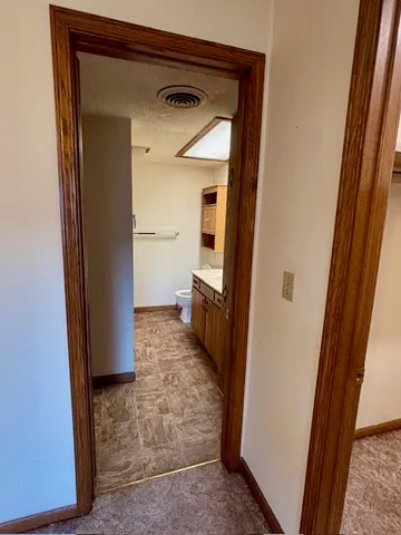 a bathroom with a bathtub and a toilet