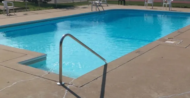 a view of a balcony and yard