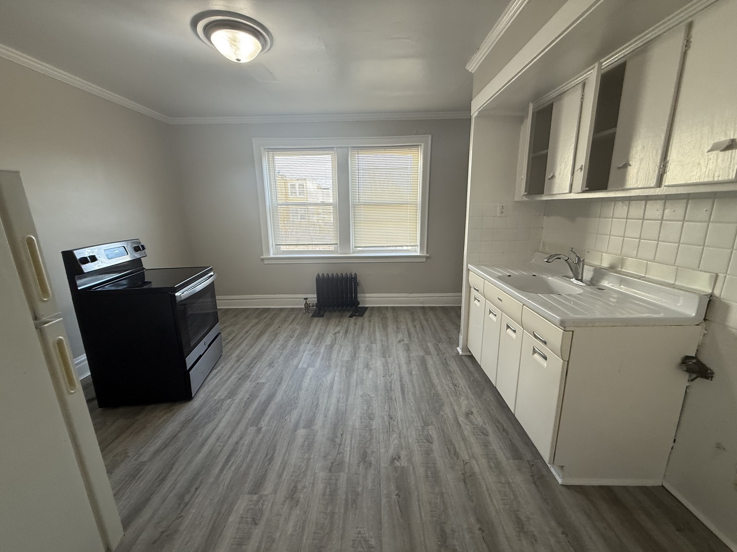 6443 23rd Street, Unit 12 Berwyn, IL 60402 - Photo 5 of 9 a hallway with cabinets