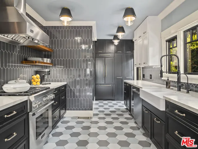 a kitchen with a sink stove and refrigerator