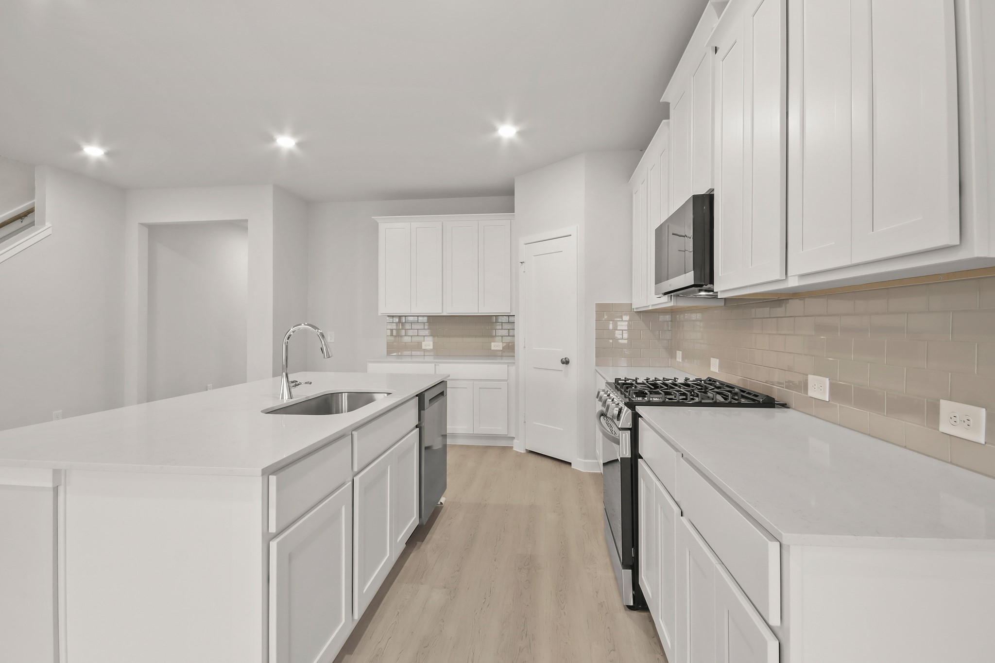 513 Wax Myrtle Way Hockley, TX 77447 - Photo 10 of 29 a kitchen with a sink stove and cabinets