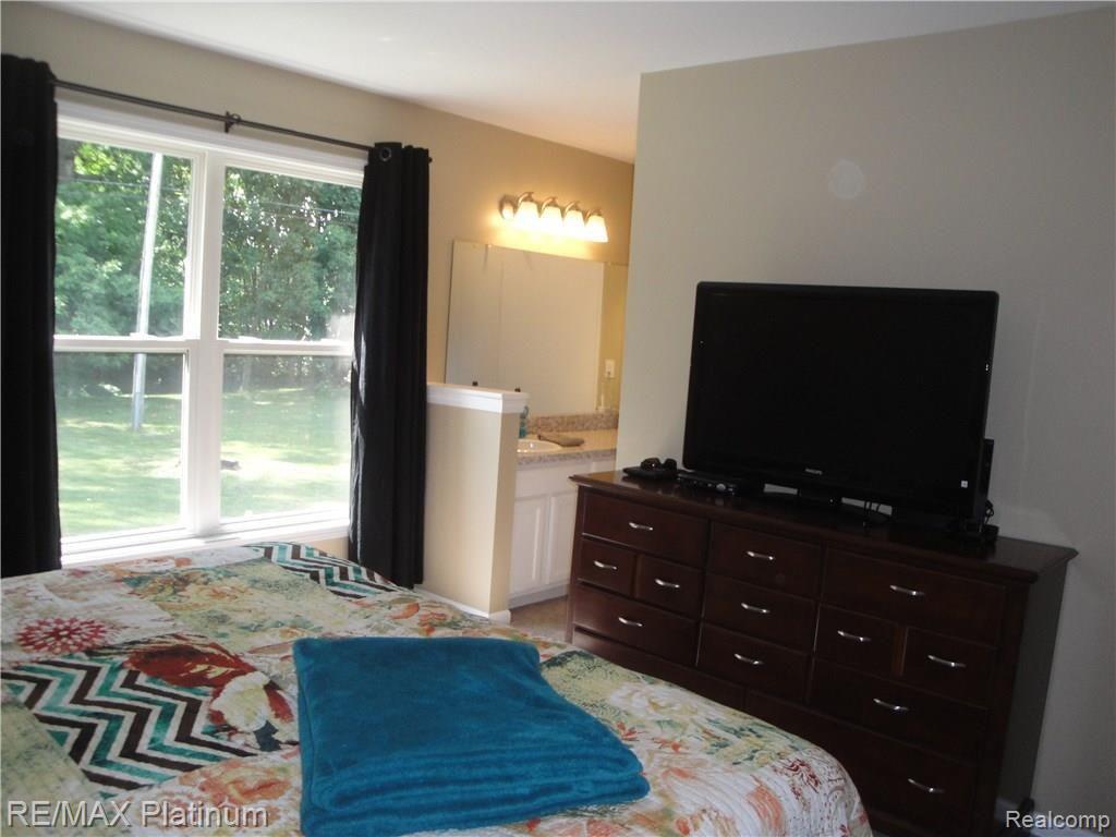 1201 Oakcrest Road Howell, MI 48843 - Photo 26 of 57 Bedroom #1 showing view toward full bath