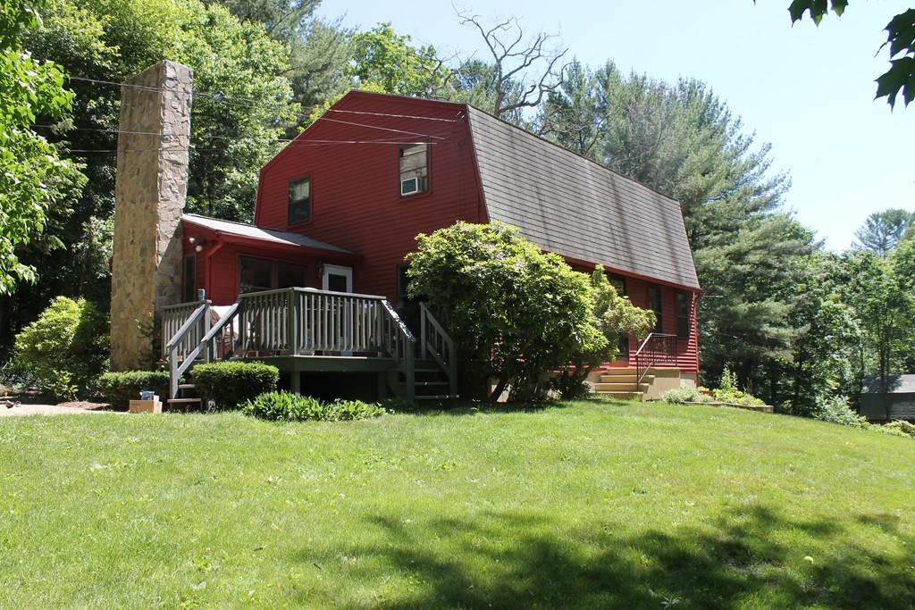 1887 North Brookfield Road Oakham, MA 01068 - Photo 1 of 23 a view of a house with a yard and sitting area
