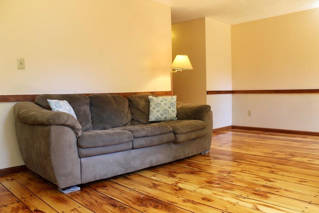 1887 North Brookfield Road Oakham, MA 01068 - Photo 14 of 23 a living room with furniture and a wooden floor