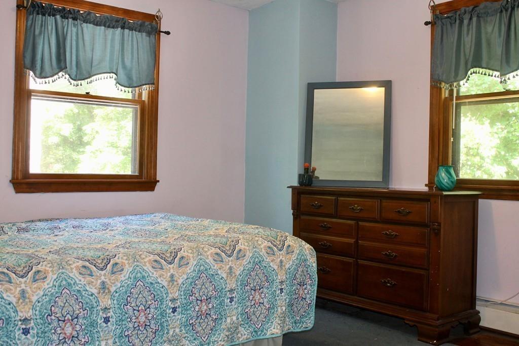 1887 North Brookfield Road Oakham, MA 01068 - Photo 19 of 23 a bedroom with a bed and a window