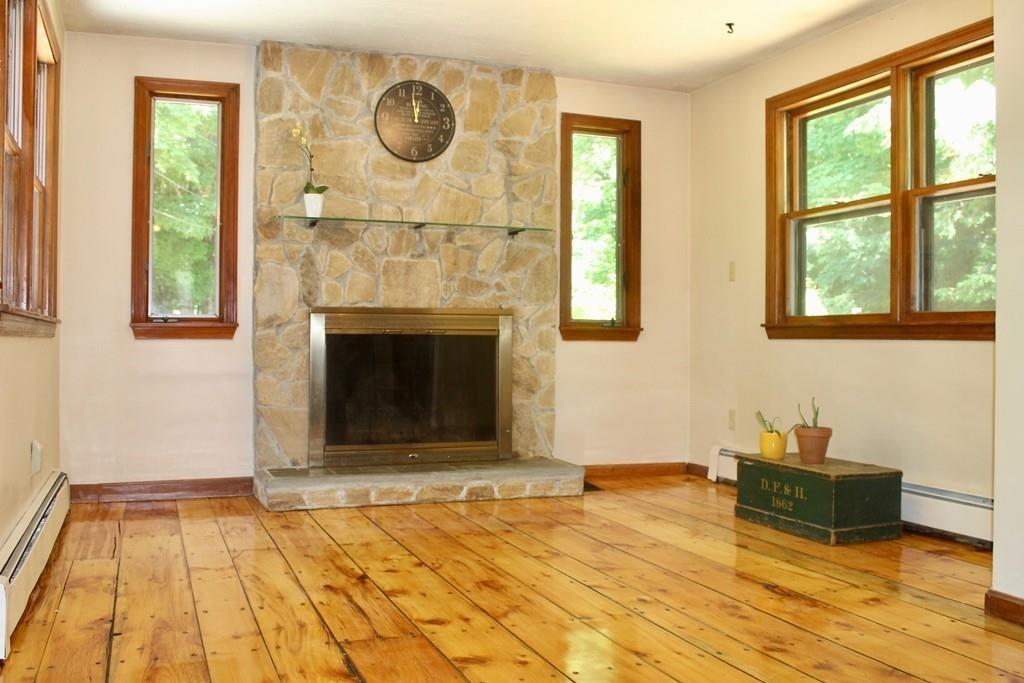 1887 North Brookfield Road Oakham, MA 01068 - Photo 7 of 23 a bedroom with a bed and a fireplace