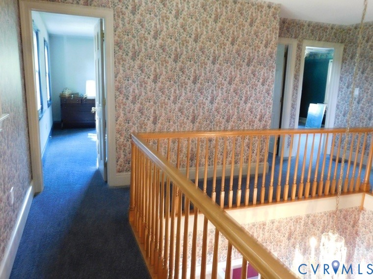 838 Crymes Road Keysville, VA 23947 - Photo 33 of 49 Corridor featuring dark carpet and wallpapered wal