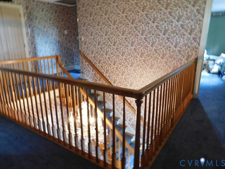 838 Crymes Road Keysville, VA 23947 - Photo 34 of 49 Stairs featuring wallpapered walls and carpet