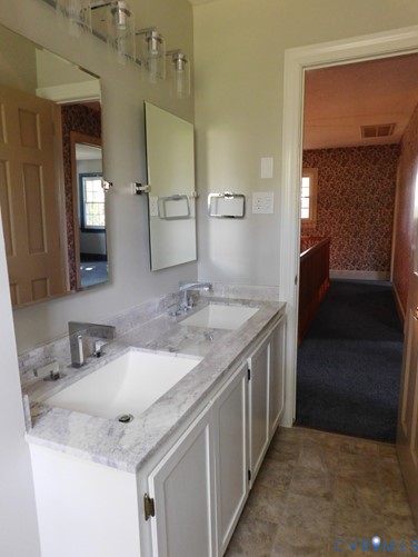 838 Crymes Road Keysville, VA 23947 - Photo 38 of 49 Bathroom featuring wallpapered walls, double vanit