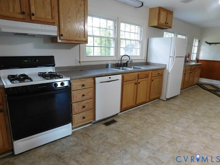 838 Crymes Road Keysville, VA 23947 - Photo 47 of 49 Kitchen featuring white appliances, under cabinet