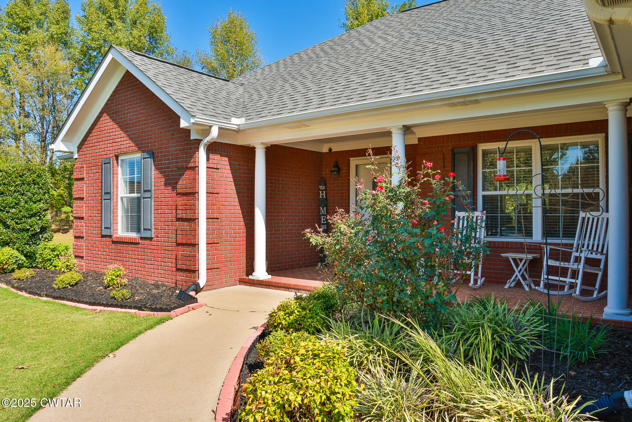 148 Scattered Acres Loop Dyer, TN 38330 - Photo 20 of 31 a front view of a house with garden