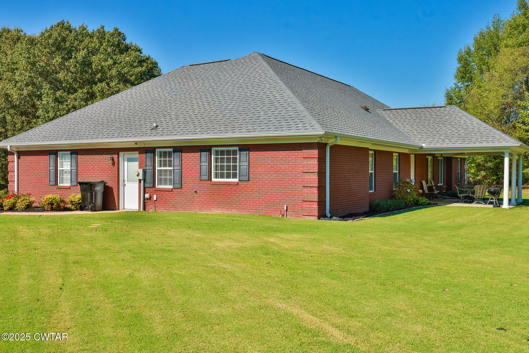 148 Scattered Acres Loop Dyer, TN 38330 - Photo 25 of 31 a front view of a house with a garden