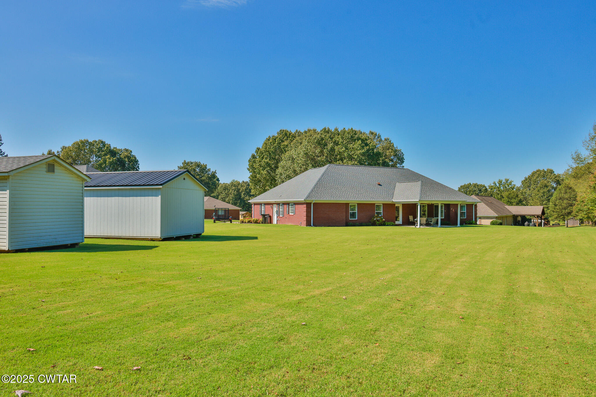 148 Scattered Acres Loop Dyer, TN 38330 - Photo 27 of 31 a front view of a house with a yard