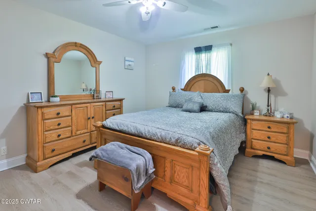 a bedroom with a bed and a dresser