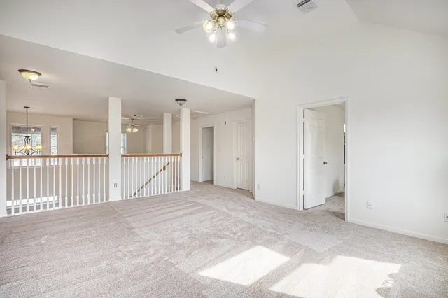 a view of a livingroom with a ceiling fan and a ceiling fan
