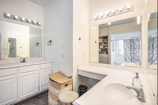 a bathroom with a sink toilet vanity and tub