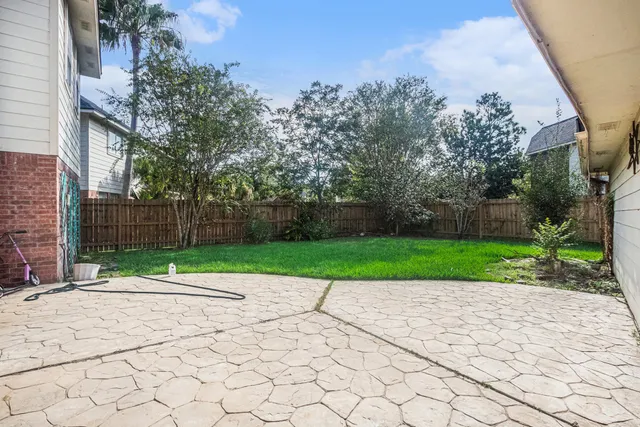 a view of park with large trees