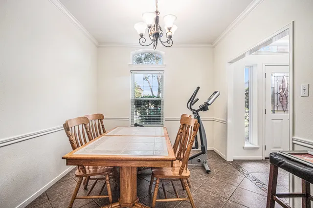 a view of a room with furniture and wooden floor