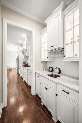 a view of a patio with a table and chairs next to a yard