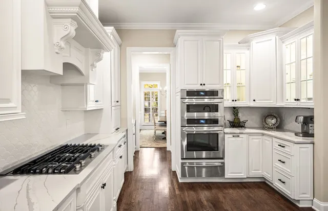 a view of a yard with large trees