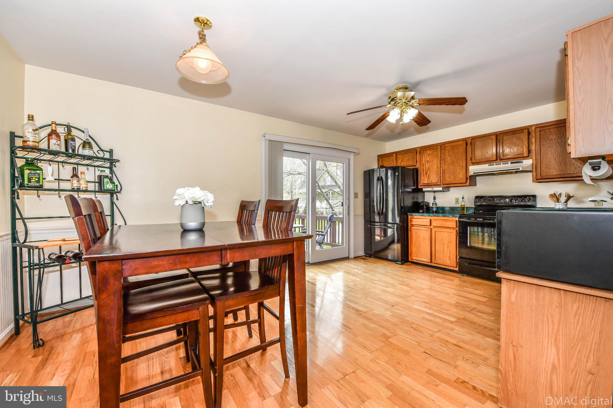 10794 Forest Edge Circle New Market, MD 21774 - Photo 3 of 41 Eat in kitchen opening up to deck