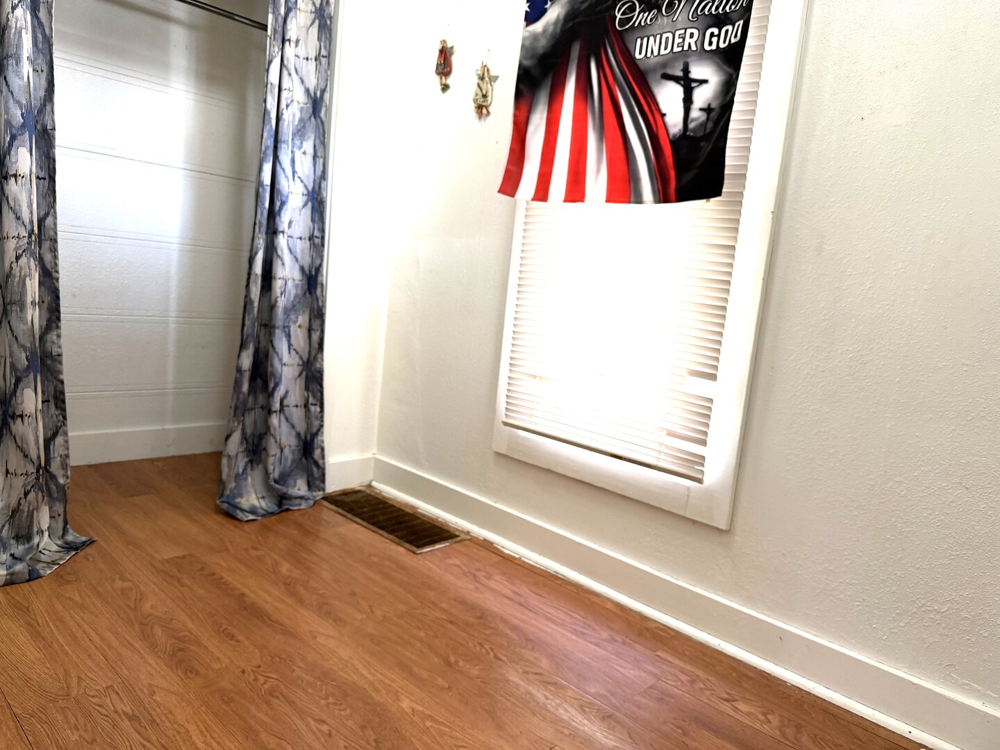 504 11th Avenue Mendota, IL 61342 - Photo 11 of 15 a view of an empty room with wooden floor and a window
