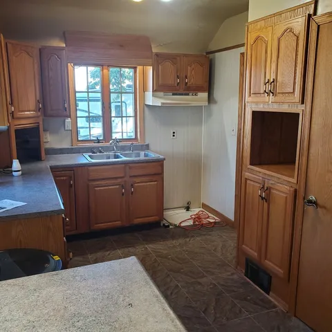 a room with wooden cabinets and a wooden floors