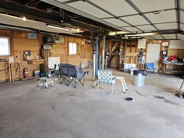 a view of parking garage with cars