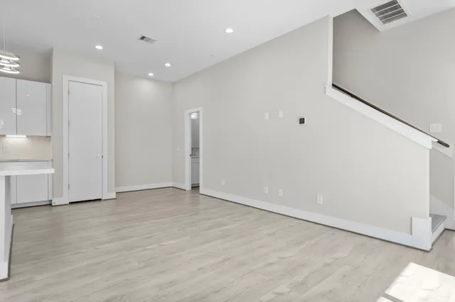a stove sitting inside of a kitchen with granite countertop