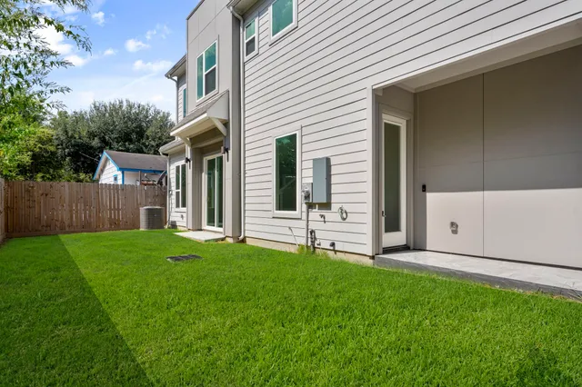 a view of a balcony with two chairs and a table