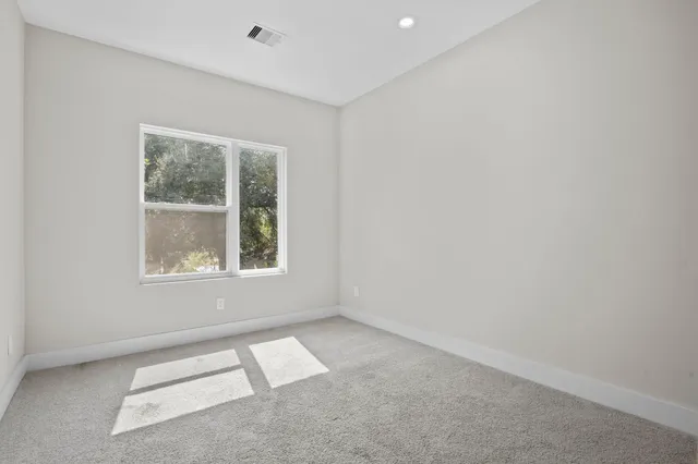 a bathroom with double vanity sink and a mirror