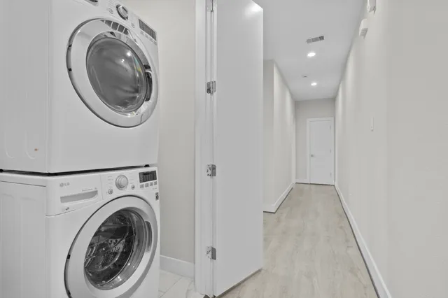 an aerial view of residential building with green space