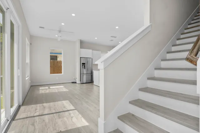 a view of kitchen with stainless steel appliances cabinets and wooden floor