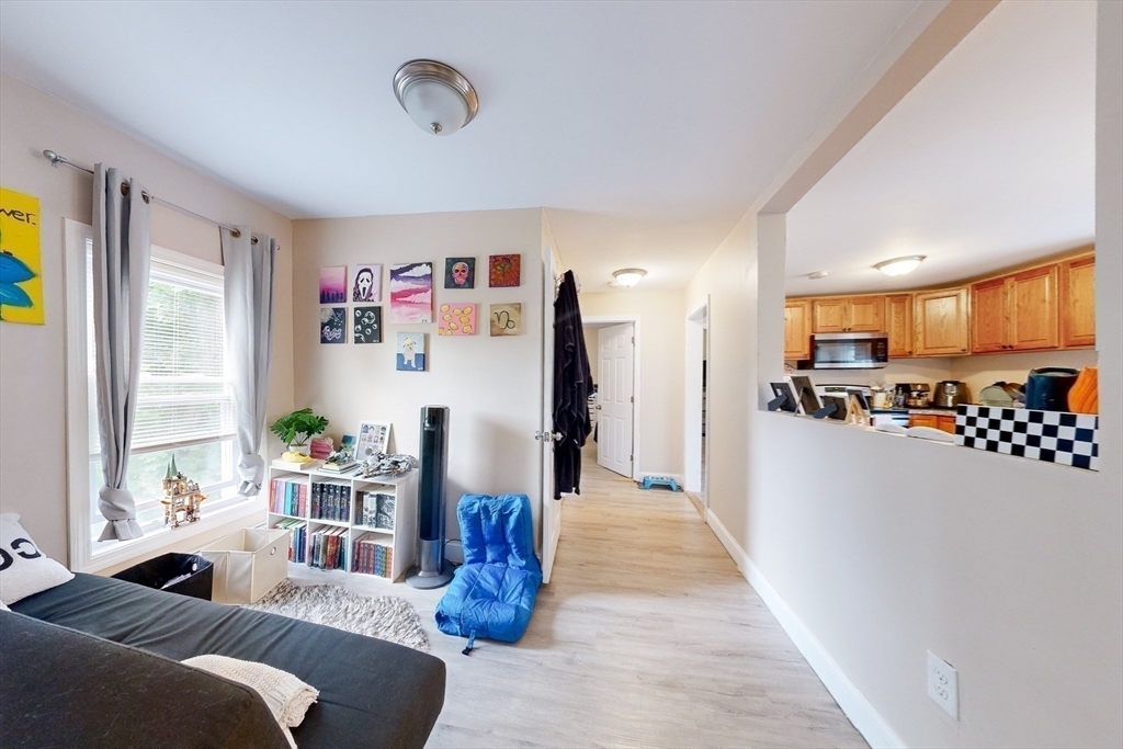 249 North Main Street Webster, MA 01570 - Photo 16 of 32 a living room with furniture fireplace and a window