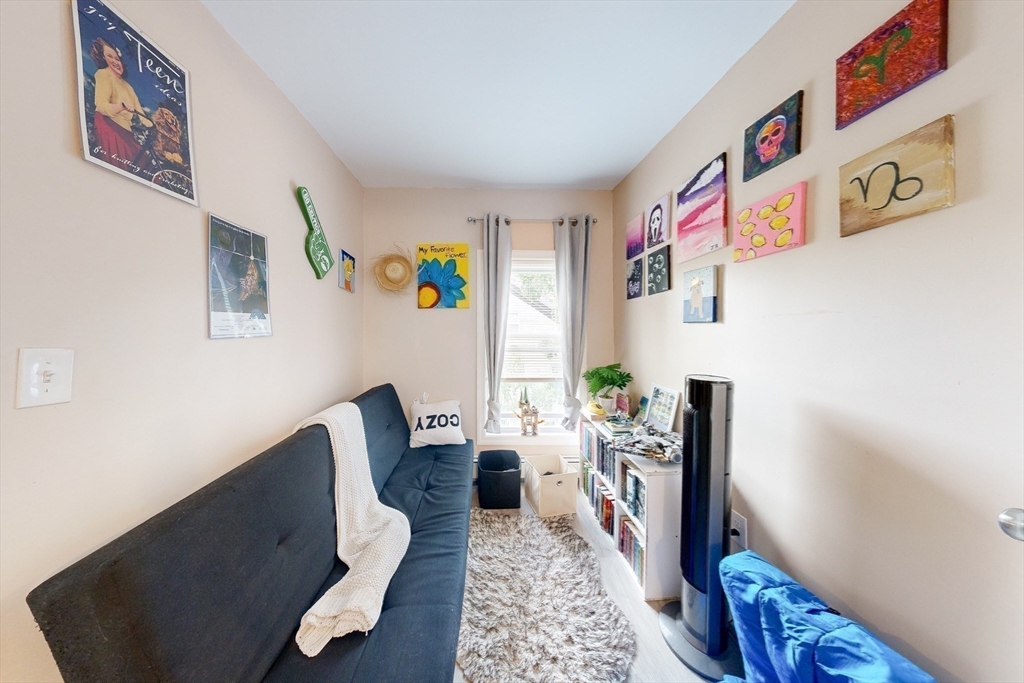 249 North Main Street Webster, MA 01570 - Photo 17 of 32 a living room with furniture and painting on the wall
