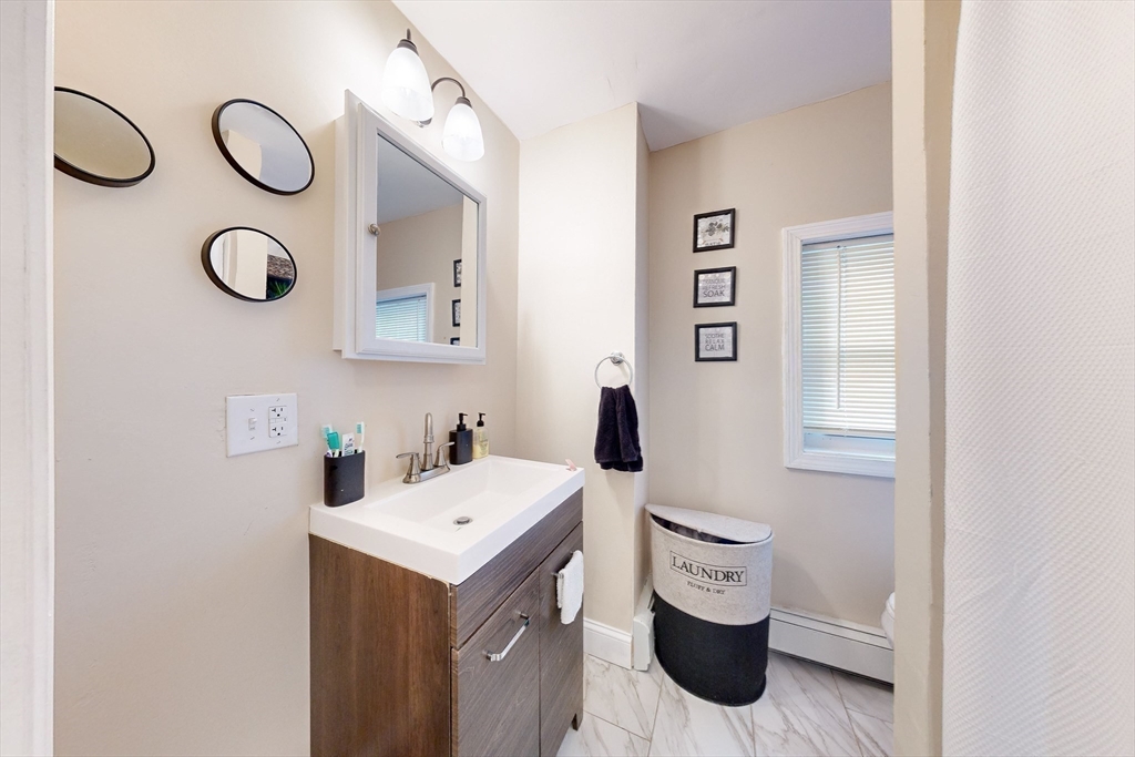 249 North Main Street Webster, MA 01570 - Photo 18 of 32 a bathroom with a toilet and a sink