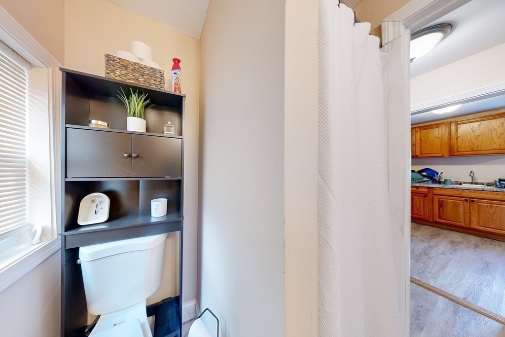 249 North Main Street Webster, MA 01570 - Photo 19 of 32 a kitchen with a refrigerator and a stove
