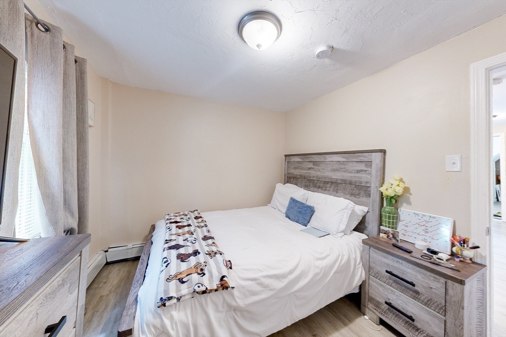 249 North Main Street Webster, MA 01570 - Photo 20 of 32 a bedroom with a bed and a window