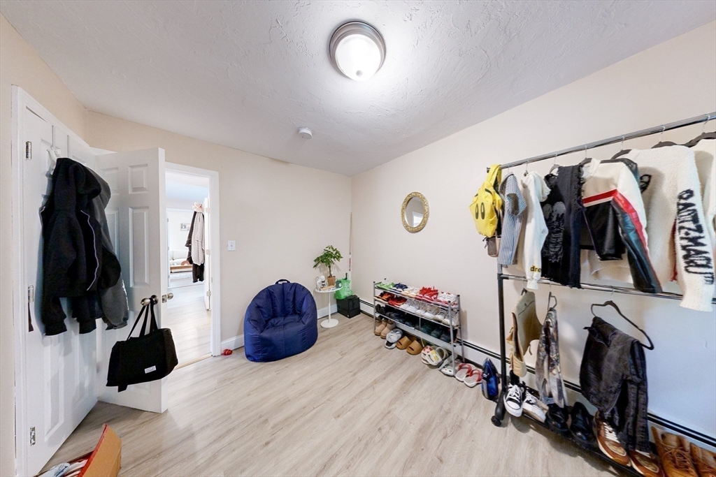249 North Main Street Webster, MA 01570 - Photo 23 of 32 a view of walk in closet with clothes and shoes